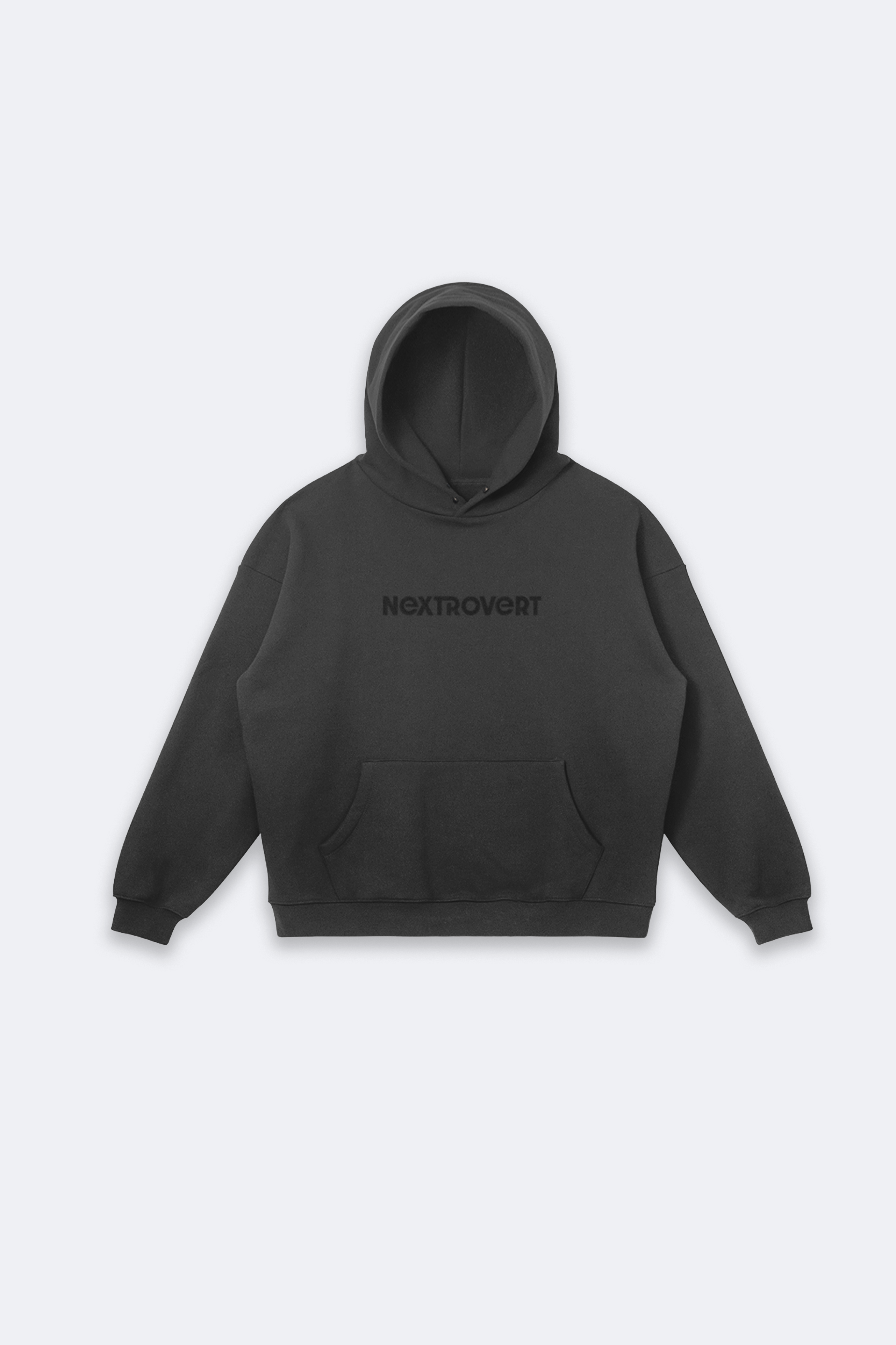 Black hoodie with 'Nextrovert' logo embroidered on the front, featuring a minimalist design with a front pocket and a comfortable, oversized fit